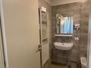 a bathroom with a sink and a mirror at Locanda Patoea Alloggi in Borgoricco +46 photos
