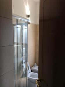 a bathroom with a toilet and a sink at Magellano Room in Verona +43 photos