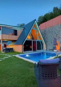 a house with a swimming pool in a yard at ByDamla Bungalov in Sapanca