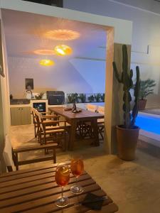 a kitchen and dining room with a table and chairs at Gioma Luxury Villas in Agios Nikolaos