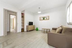 a living room with a couch and a table at Casa Due Spighe in San Sperate