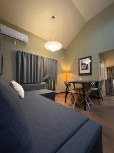 a bedroom with two beds and a table with chairs at Shinjuku Topshot Hotel in Tokyo