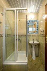 a bathroom with a shower and a sink at Mango Apartment Petrovac in Petrovac na Moru