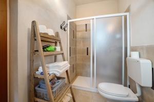 a bathroom with a toilet and a shower at Cascina Brignolo - Casa Bianca in Novara +42 photos