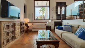 a living room with a couch and a table at Villa Radi by Eivillas in Santa Gertrudis de Fruitera