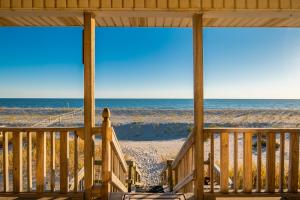 a porch with a view of the beach at Lady Dune in Oak Island