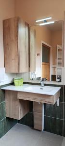 a bathroom with a sink and a mirror at Aux 10 Ponts Maison spacieuse et conviviale au bord de la Somme la mer à 30 min 6 personnes in Pont-Rémy +83 photos