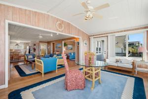 a living room with a table and chairs at Late For The Sky in Caswell Beach +86 photos