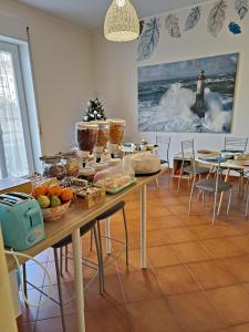 a table with food on it in a room at B&B il Faro in Salerno