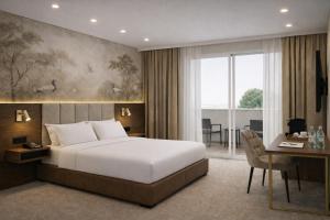a hotel room with a bed and a desk and a desk at Elitis House - Suite & Spa in Nova Milanese