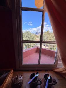 a window with a view of a mountain view at Maité Hospedaje in Santa María