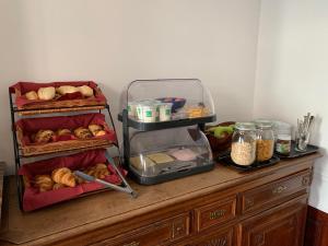 a wooden counter with bread and other food on it at Albert Molière in Brussels