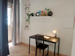 a desk with a chair in a room at Loft Centrico - Bahia 2B in Santander
