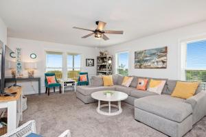 a living room with a couch and a table at Linger Longer in Caswell Beach +91 photos