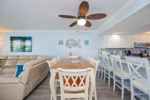 a living room with a couch and a table at Wind Drift 615N condo in Orange Beach
