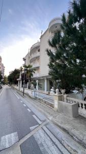 an empty street in front of a building at Villa Kliven in Durrës