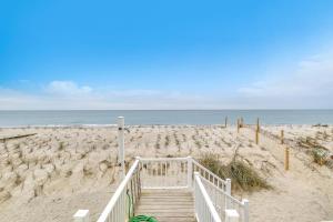 a wooden staircase leading to a sandy beach at Lisa Lu in Oak Island