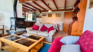 a living room with a couch and a table at La casa del Torreón in San Isidro