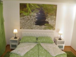 A bed or beds in a room at Apartments Perla