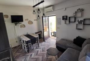 a living room with a couch and a table at Haus Cataleya in Umag