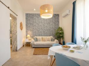 a living room with a couch and a table at Casa Bambu in Polignano a Mare