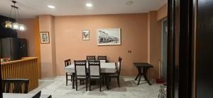 a dining room with a table and chairs at CityCenterHotel Shkoder in Shkodër