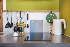 a kitchen counter with utensils on a counter top at Beim Senner in Halblech