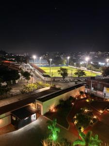 a view of a soccer field at night at Apartamento Studio in Arujá +3 photos