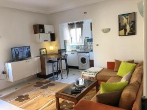 a living room with a couch and a table at Waterside in Hammam Sousse