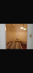 a bedroom with a bed and a table and lights at Casa dei lupi in Montefalco