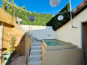 a swimming pool on the side of a building at beachhousebarn in Vendays-Montalivet