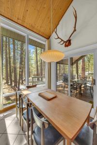 a dining room with a wooden table and chairs at Pine Mountain - Unit 13 in Sunriver