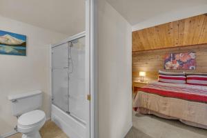 a bathroom with a bed and a shower with a toilet at Pine Mountain - Unit 13 in Sunriver