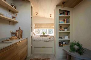 a small room with a bed and a window at The Nook Guest House in Letchworth