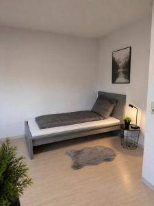 a bedroom with a bed in a room with a rug at Apartment Kist bei Würzburg in Kist