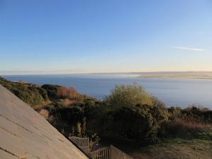 a view of a body of water from a roof at Kestrel, Longhouse Cottages in Rosemarkie