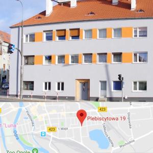 a map with a building in the background at Apartament z KLIMATYZACJĄ - ul Plebiscytowa 19 - darmowy parking in Opole +2 photos
