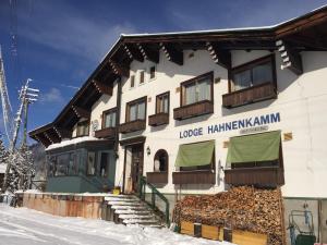 a building with a sign on the side of it at Lodge Hahnenkamm in Nozawa Onsen