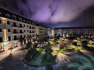 an aerial view of a city at night at DOS GATOS Hotel in Ðố Sơn