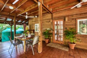 a dining room with a table and chairs at TropicalArts Resort&Studios in Bocas Town
