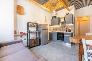 a kitchen with a couch and a table at Kasa Kalagonis in Maracalagonis