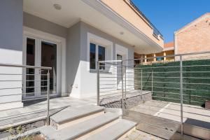 a home with metal railings on the stairs at Kasa Kalagonis in Maracalagonis
