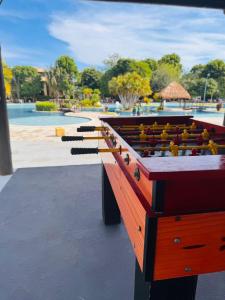 a row of tables with birds on them in a park at Iloa Residence V13 Beach - localização privilegiada in Barra de São Miguel