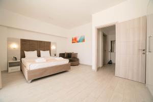 a large bedroom with a large bed and a couch at Capital Rooms in Ulcinj +40 photos