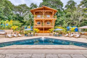 a villa with a pool and a house at TropicalArts Resort&Studios in Bocas Town