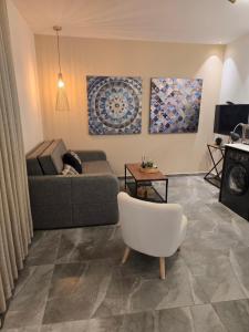 a living room with a couch and a chair at Luxury Queen Mountian in Eilat