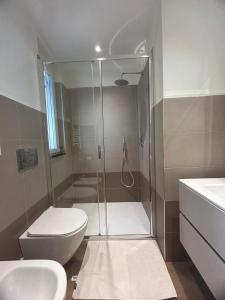 a bathroom with a shower and a toilet and a sink at Putti giocosi in Genoa +14 photos