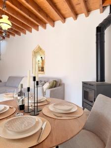 a dining room with a table with candles on it at Estia Vouni Boutique Houses in Vouni