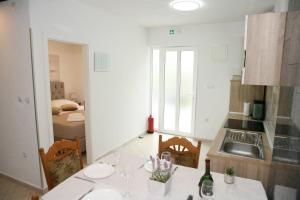 a kitchen with a sink and a counter top at Apartments Old Town in Trogir +77 photos