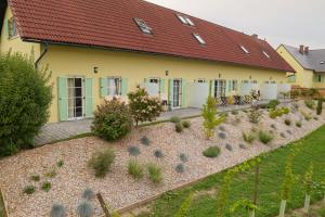 a house with a garden in front of it at ILLYRHof in Gamlitz